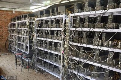 A modern mining farm with rows of mining rigs